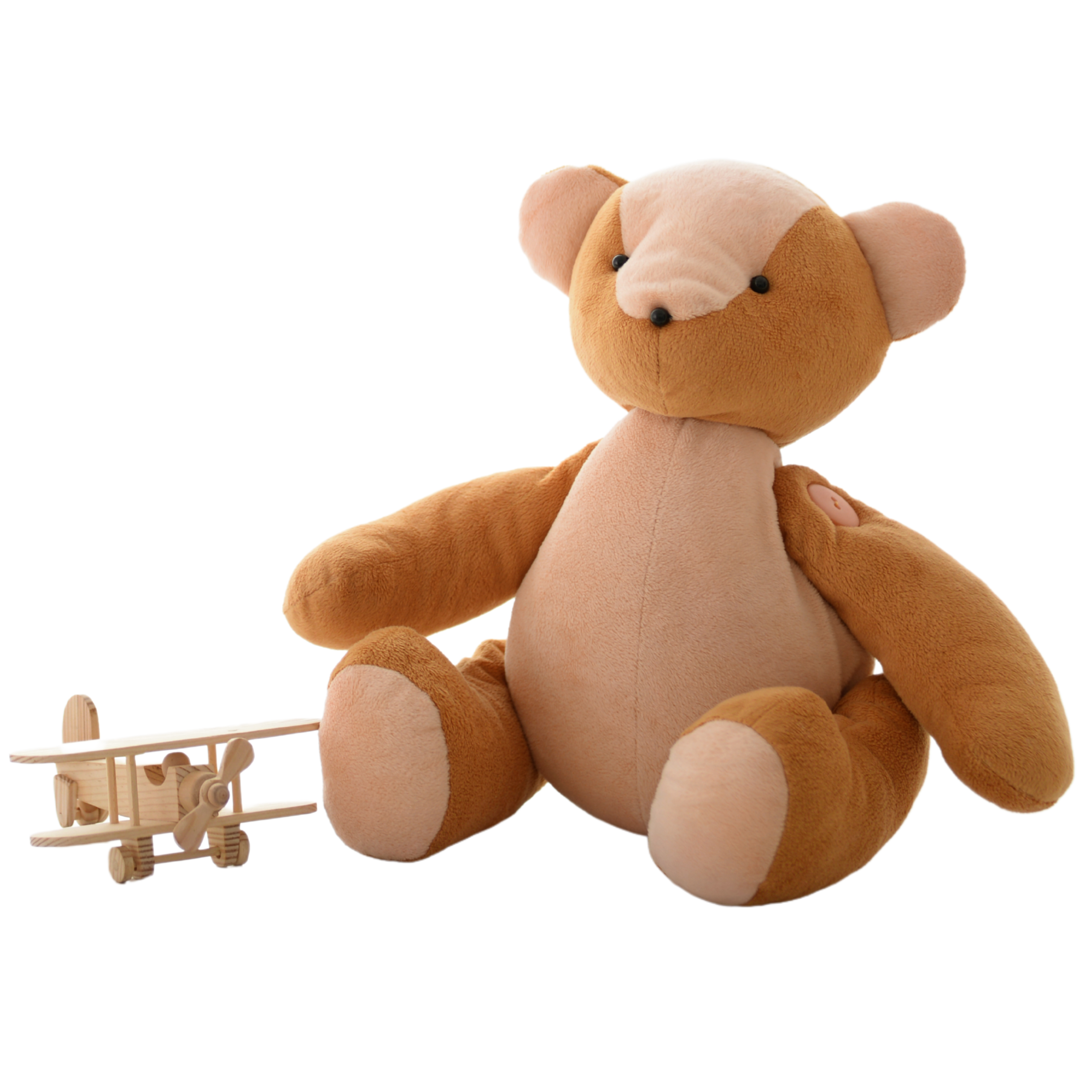 Kids' toy bear and small wooden airplane